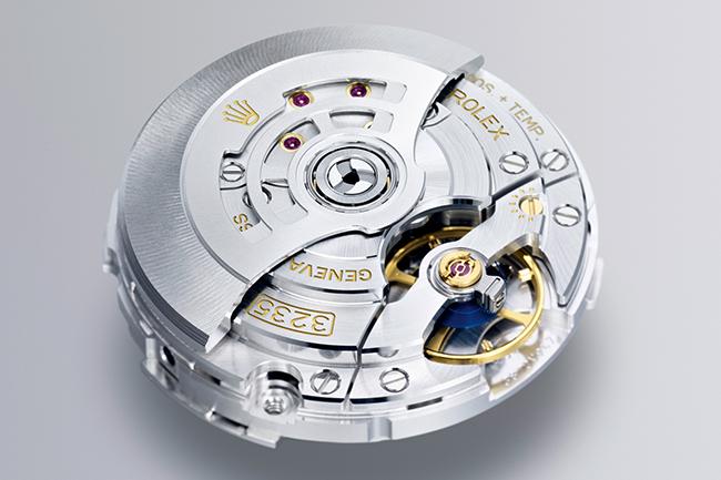 The Super Clone Rolex watch's fine movement is on display, showing its inner workings